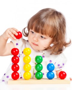 little girl playing with balls